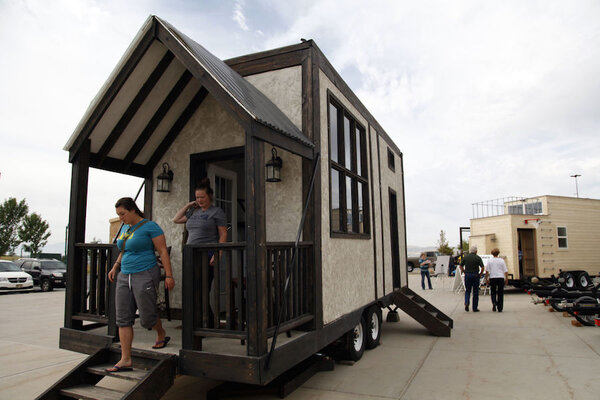 brynna brockback left and leslie kay right exit a model tiny house at a display outside the cabelas in lehi utah the tiny home movement is a