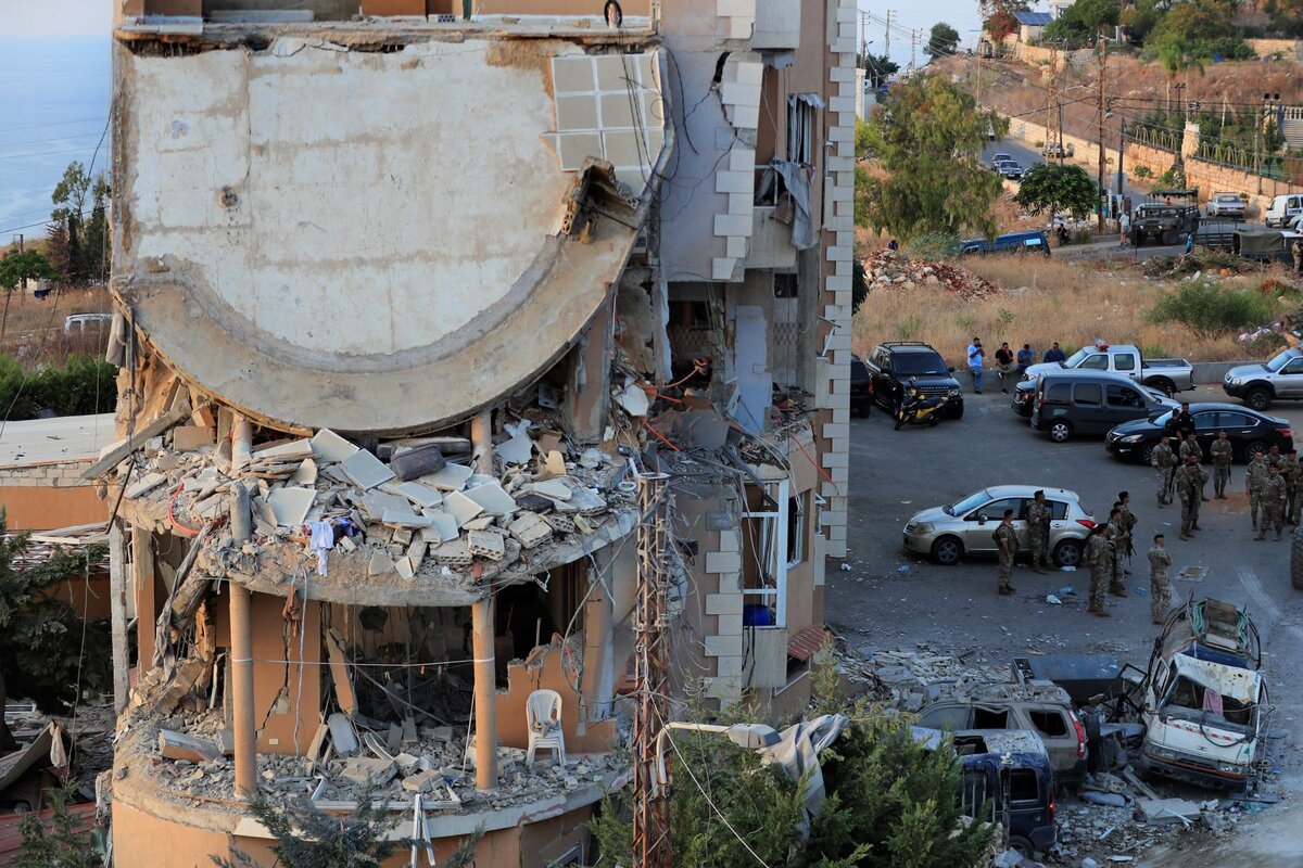 Lebanese army soldiers deploy around a destroyed building hit by an Israeli airstrike, in Barja village, Lebanon, Oct. 12, 2024. 