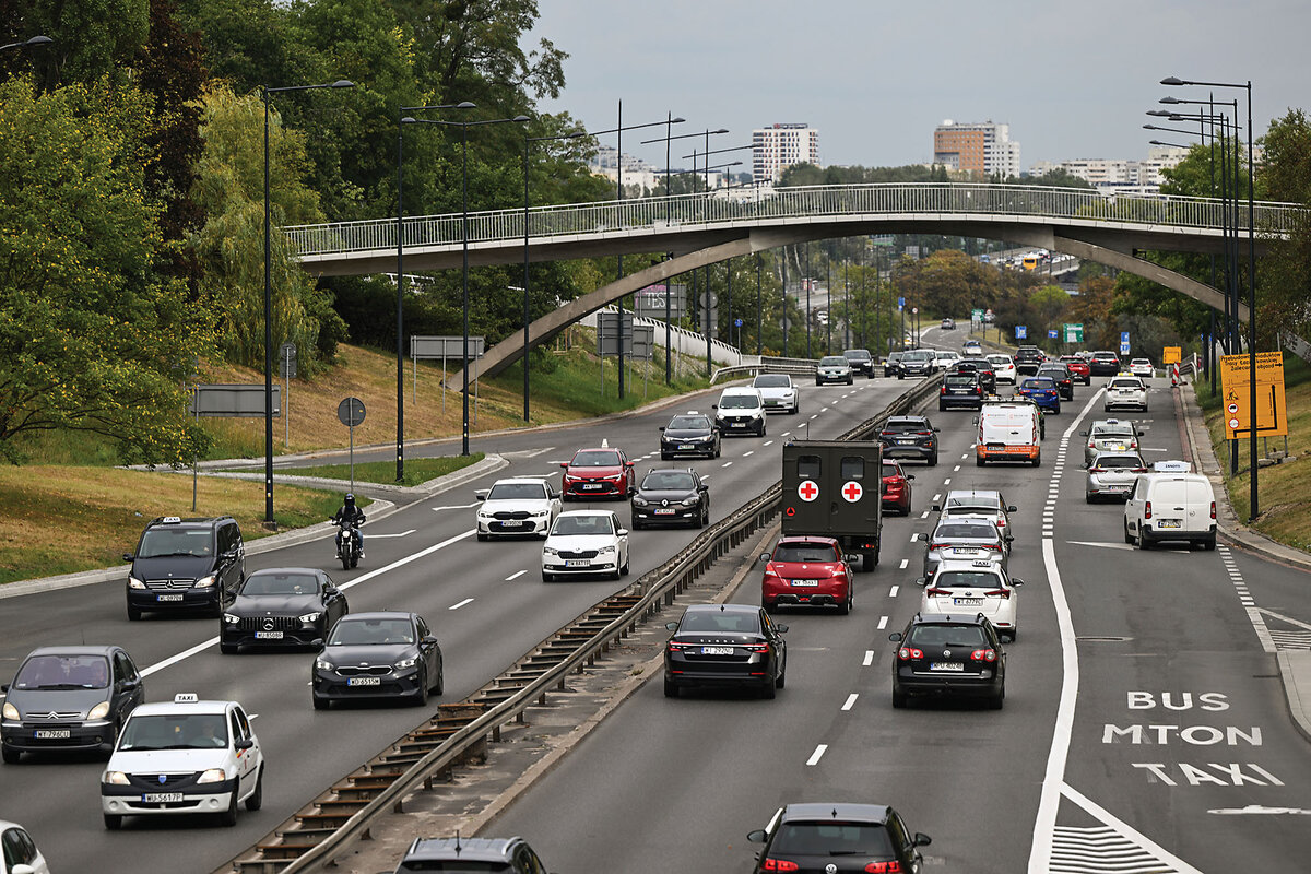 A multi-lane highway in Warsaw, Poland, shows dozens of cars. Roads are significantly safer than they were three decades ago.