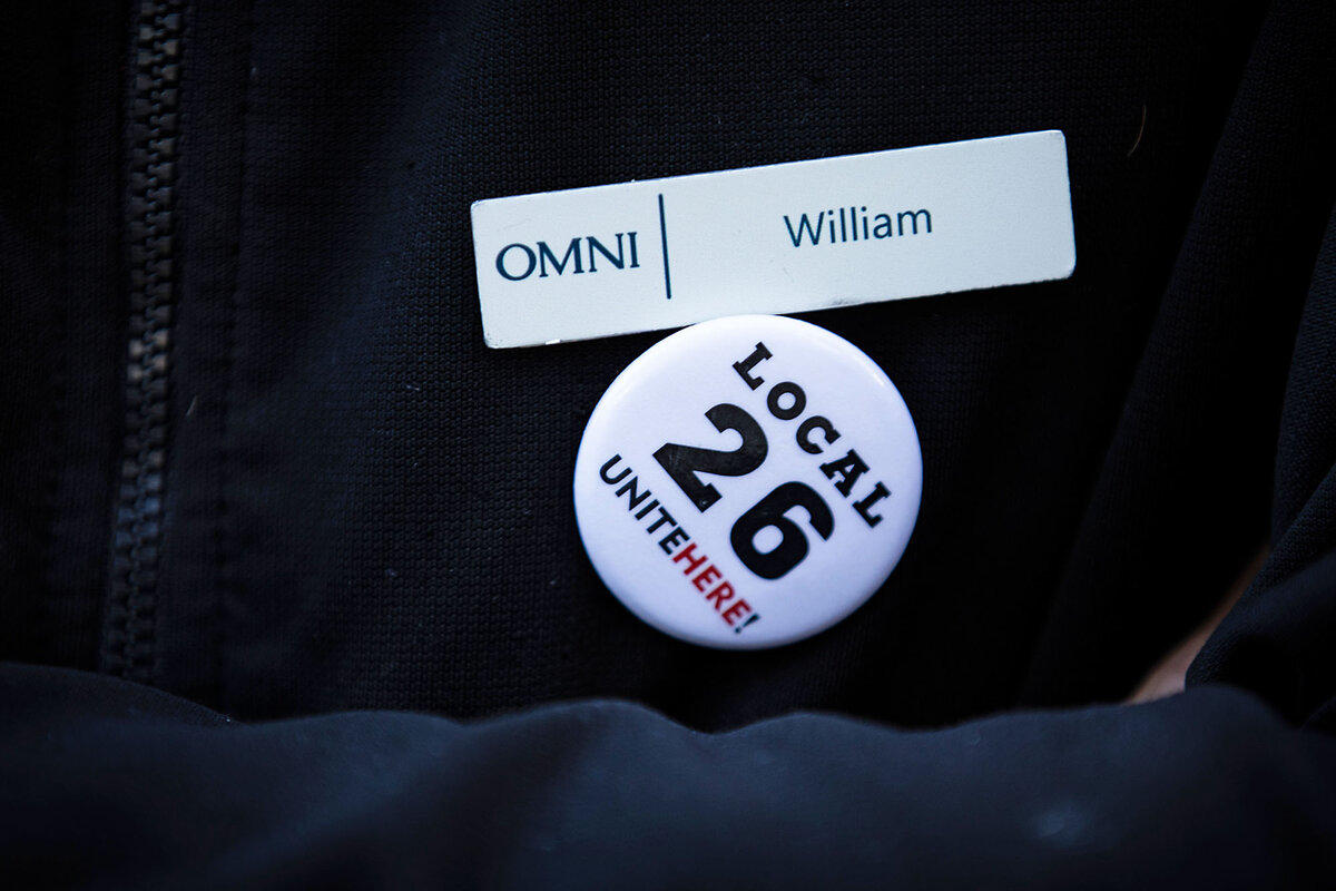 William Brown's name tag at the Omni Boston Hotel and his union button with showing 'Local 26 Unite Here!' Mr. Brown represents about 300 of his co-workers.