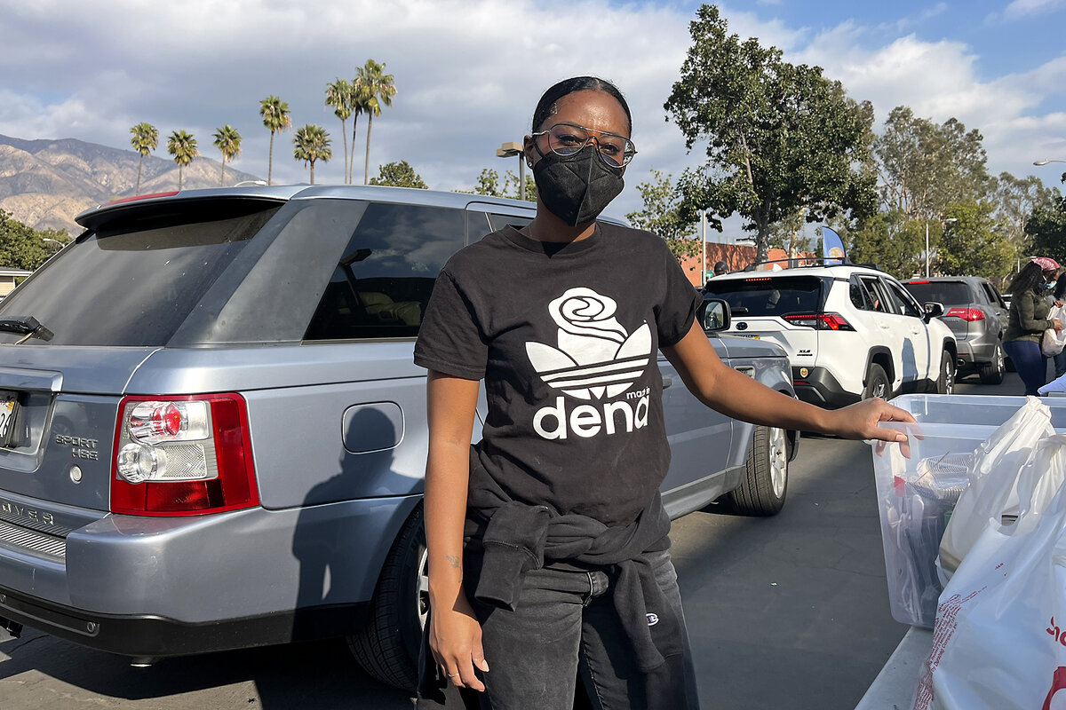 Volunteer Chanel Jackson loads up groceries for evacuees from the Eaton Fire at the Pasadena Church in California.