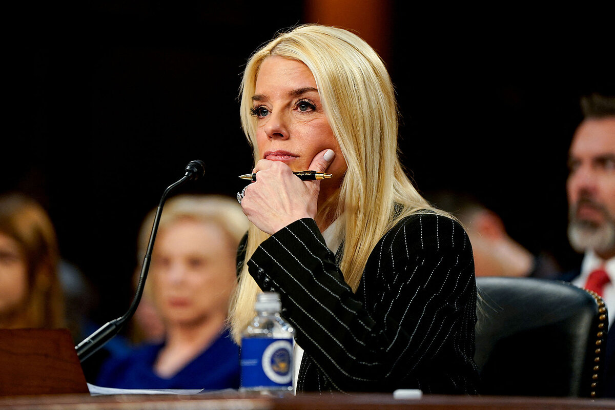 Pam Bondi listens as she testifies before U.S. senators.