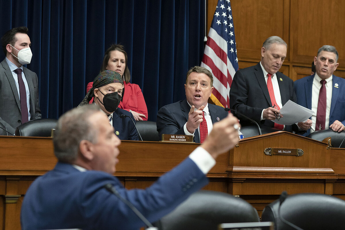 Republican Rep. Pat Fallon points and argues with Rhode Island Democratic Rep. David Cicilline, who is sitting and gesticulating while other members of Congress look on.