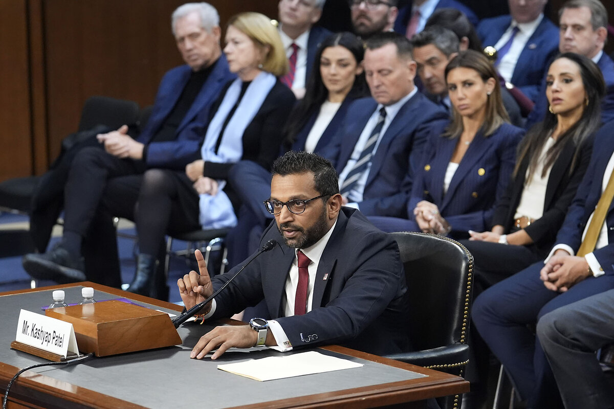 Kash Patel, seated, responds to questions in his confirmation hearing.