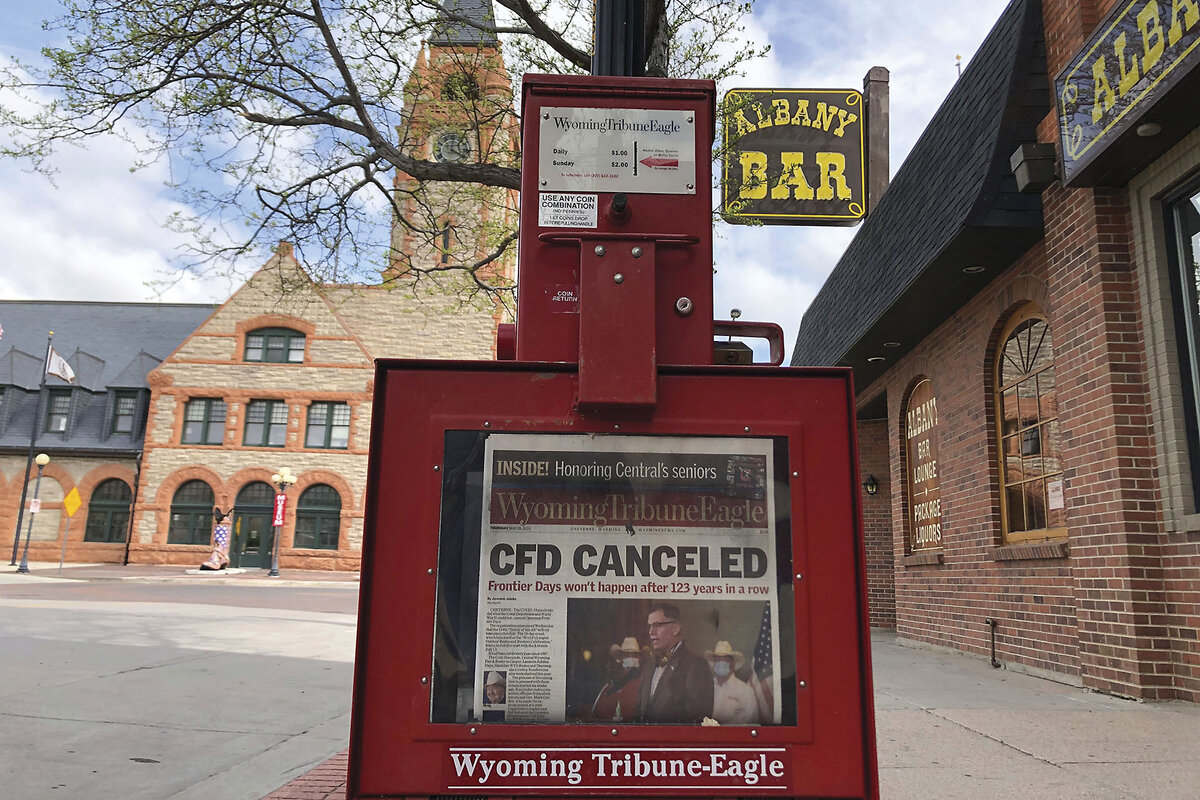 Near the rail depot in Cheyenne, Wyoming, a newspaper vending box shows the Wyoming Tribune Eagle newspaper for sale.