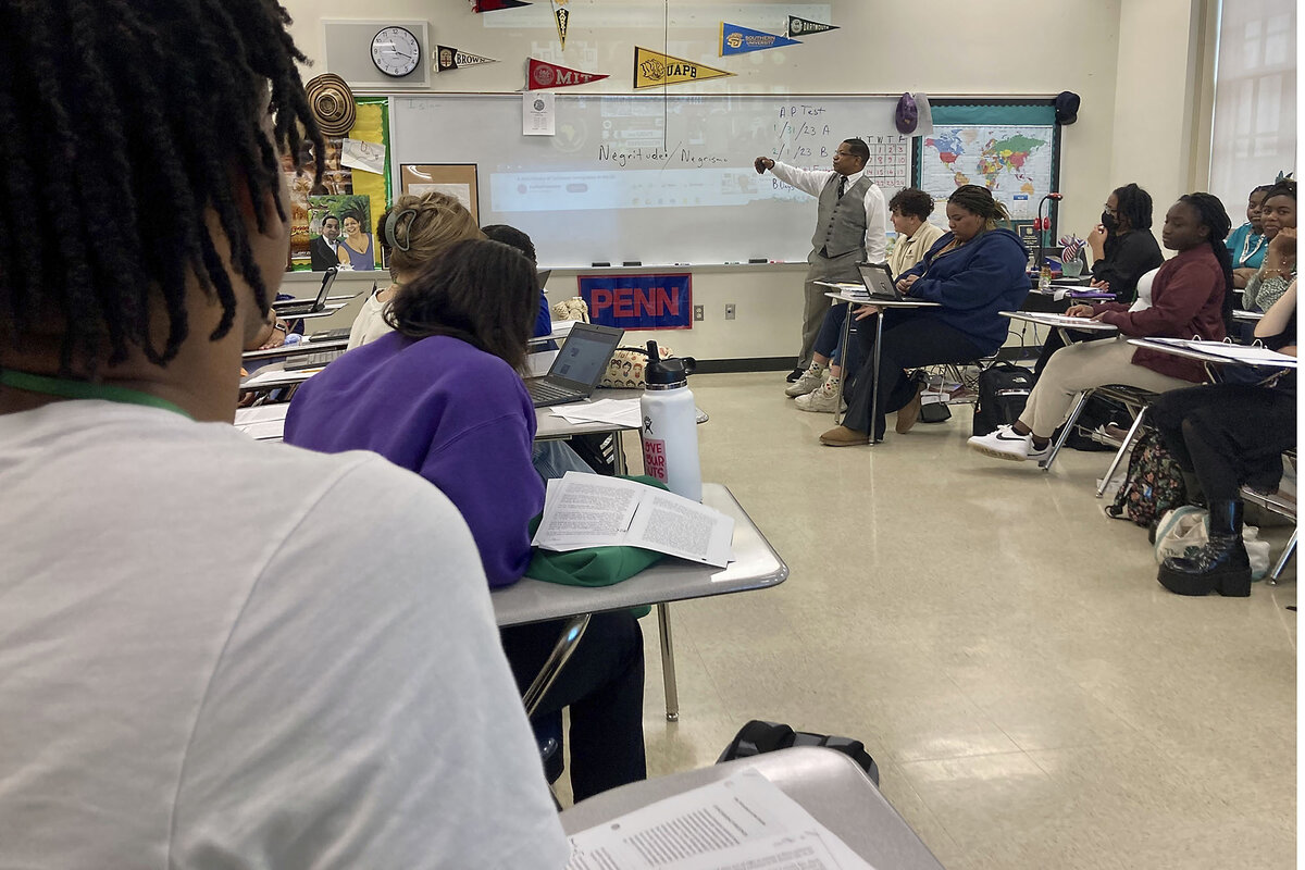 Teacher Emmitt Glynn stands at a whiteboard in front of a class of students at Baton Rouge Magnet High School.