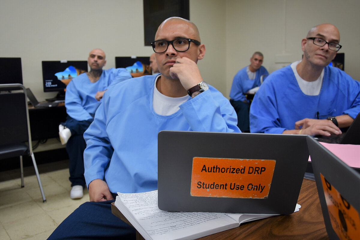 Antonio Barajas, who is incarcerated at Pelican Bay State Prison, sits in a classroom with notes in front of him.