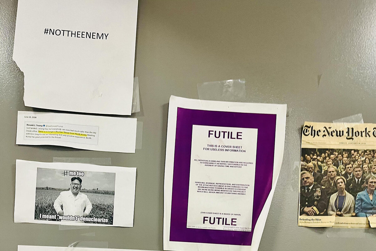 Signs hang on the door of the Pentagon press room for correspondents. 