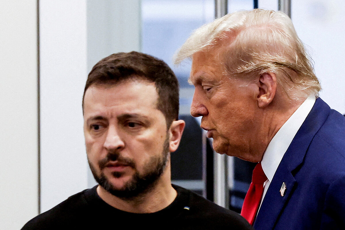 Donald Trump and Volodymyr Zelenskyy stand side by side.