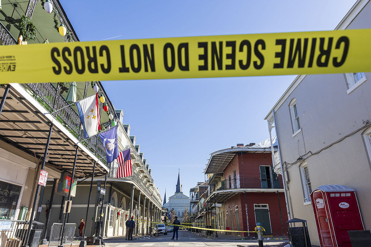 Yellow police tape blocks off Bourbon Street in New Orleans.