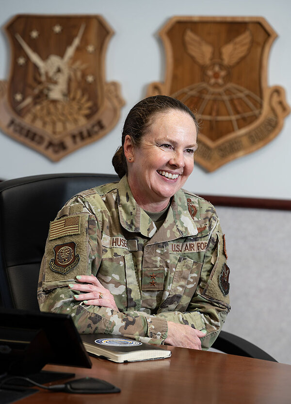 Maj. Gen. Stacy Jo Huser smiles from behind a desk.