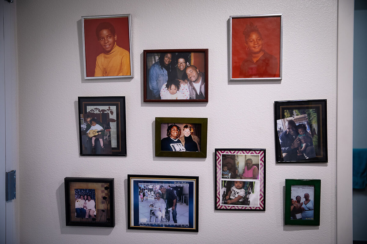 Family portraits hand on a wall in Evelyn Sheppard’s apartment. They are the only ones to survive the Eaton Fire.