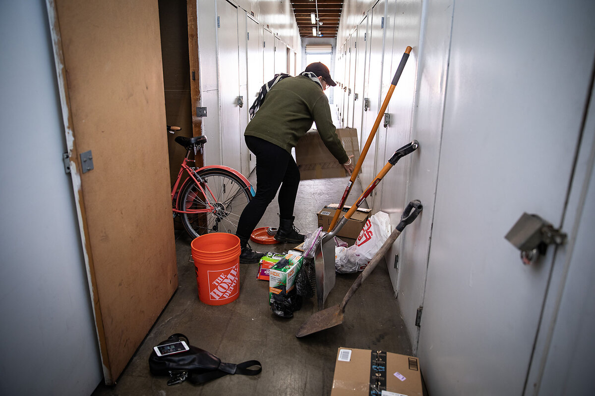 Nicole Moore collects a shovel, protective gear, and other items to go search through the rubble of her home.