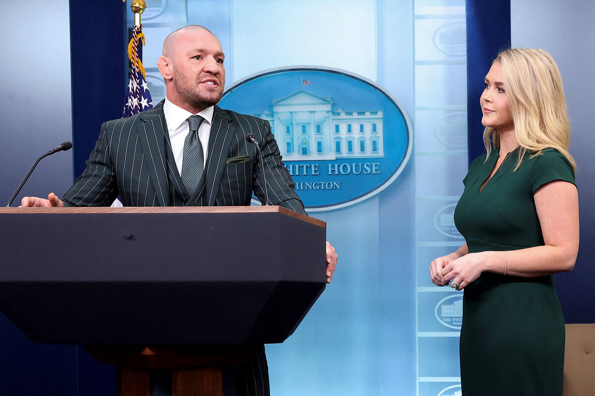 Irish UFC fighter Conor McGregor stands at the briefing room lectern with White House press secretary Karoline Leavitt, March 17, 2025.