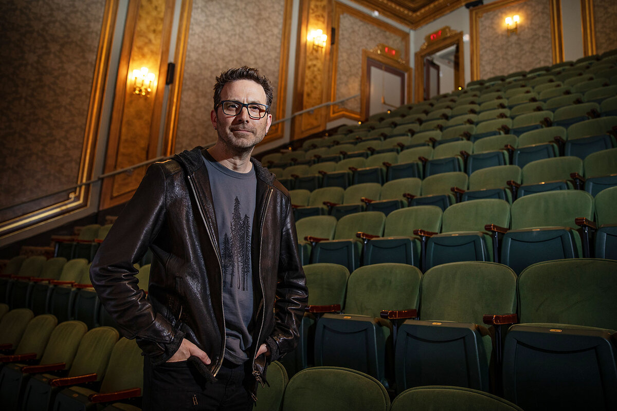 Set designer Jason Ardizzone-West stands near the seats in the Nederlander Theatre.