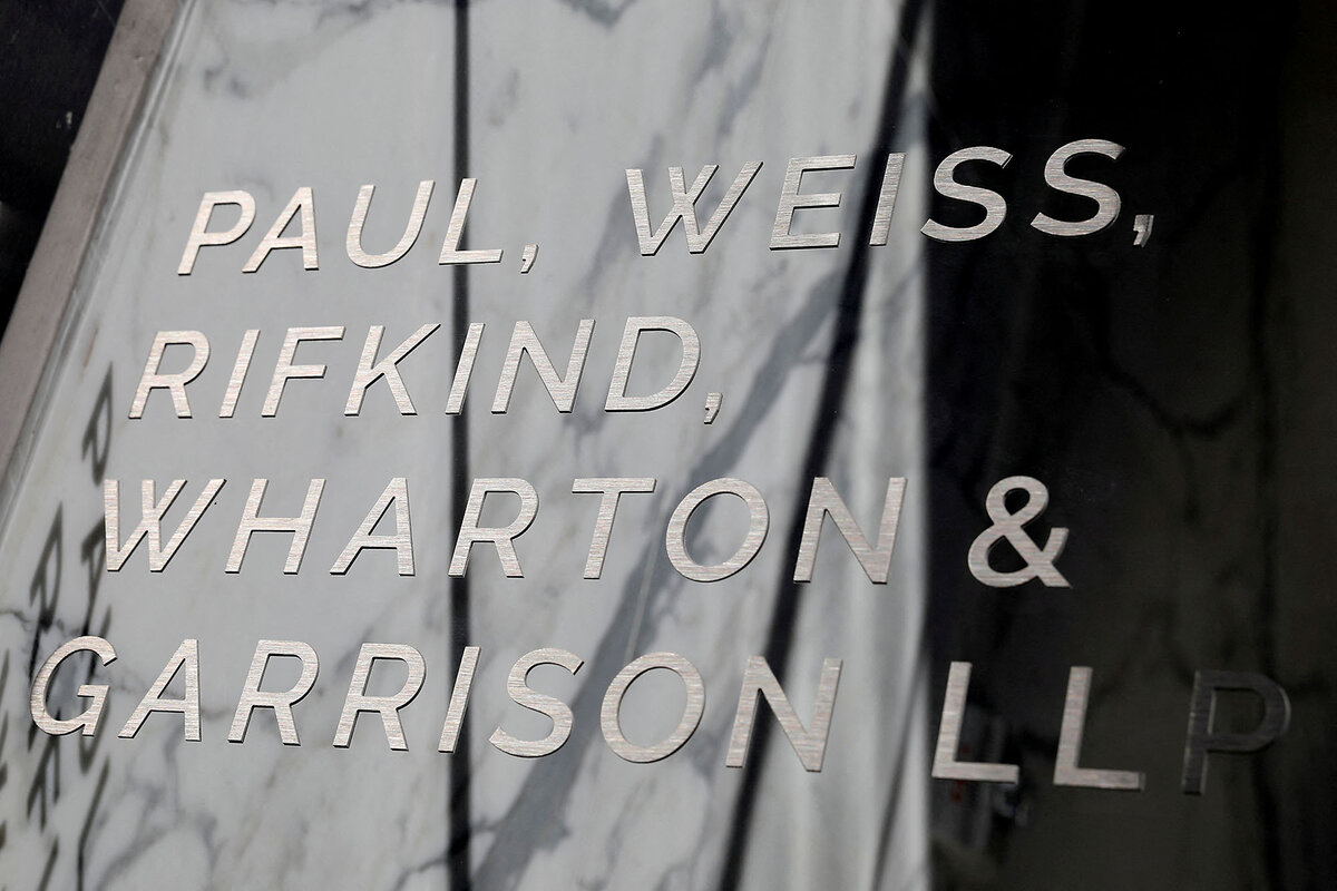 A shiny sign displays the name Paul, Weiss, Rifkind, Wharton & Garrison, one of several law firms now threatened with Trump administration sanctions.