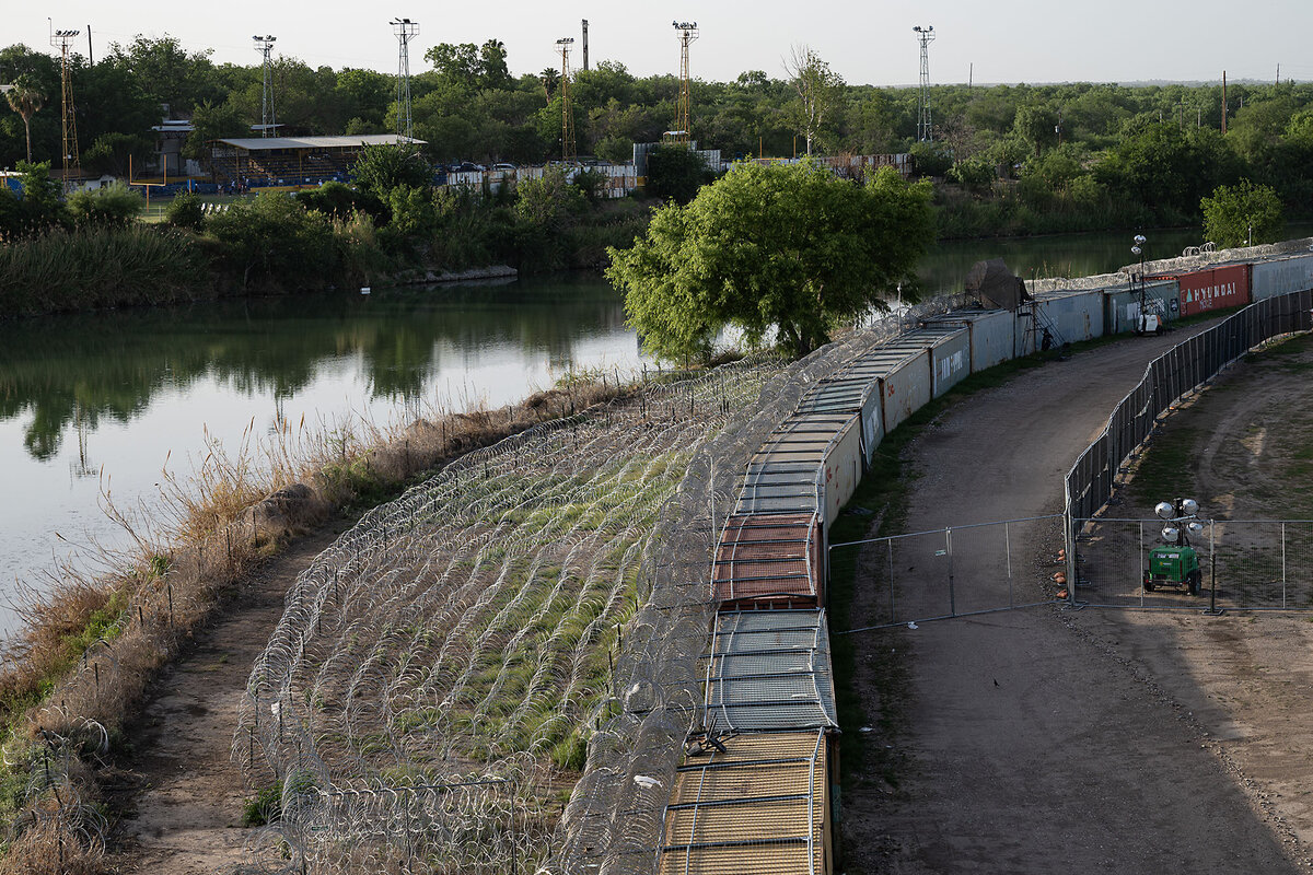 A Texas National Guard staging area stands next to the Rio Grande and Shelby Park in Eagle Pass, Texas. 