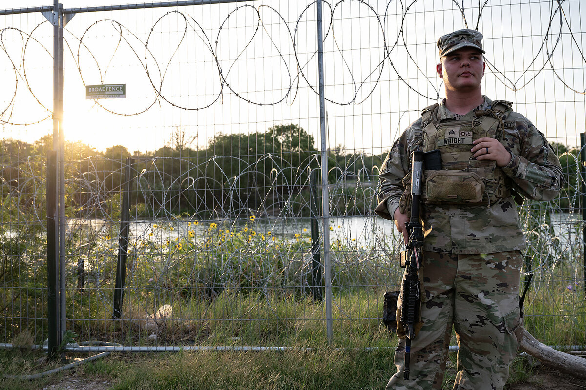A Texas National Guard member stands watch in Shelby Park in Eagle Pass, Texas, in May. Last year, the park was closed as agencies contended with a high number of attempted border crossings. It's partially reopened now.
