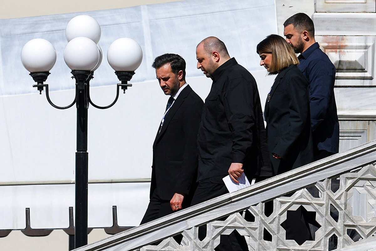 Ukrainian Defense Minister Rustem Umerov, his head down in conversation, leaves the Ciragan Palace with his delegation after brief Russia-Ukraine peace talks.