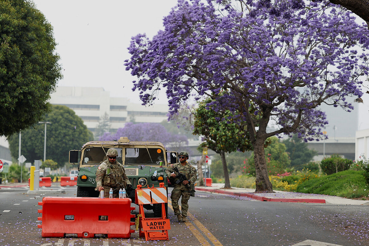 National Guard members patrol in front of the FBI Los Angeles Field Office Federal Building.