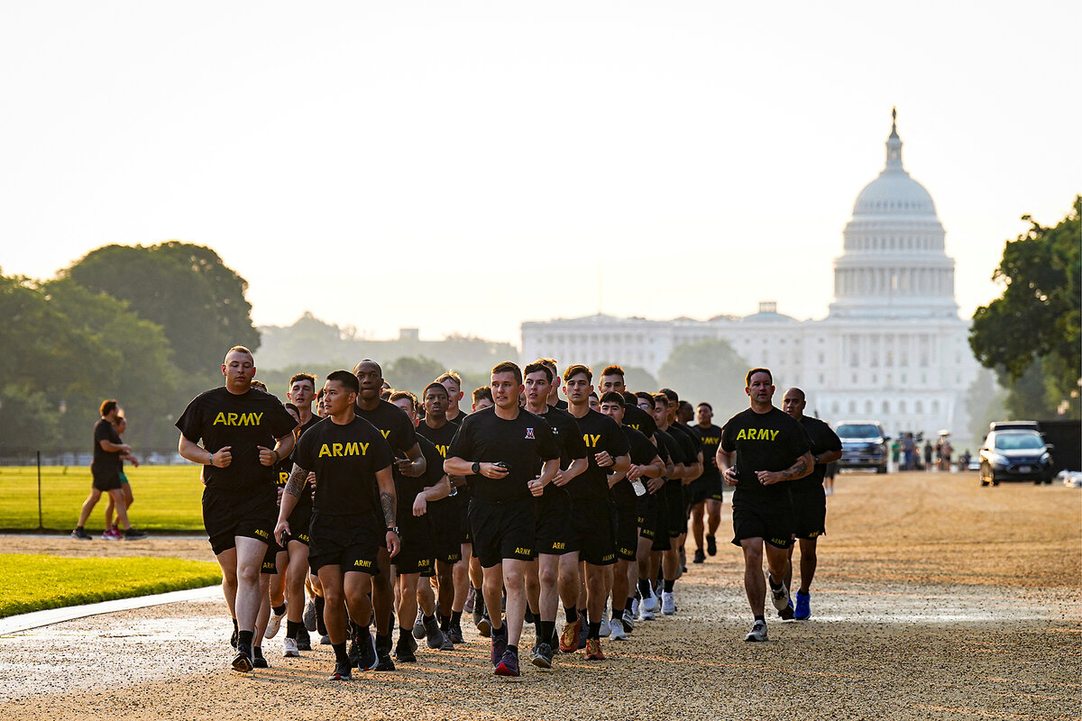 Members of the U.S. Army take a run on the National Mall during morning physical training in Washington, D.C.