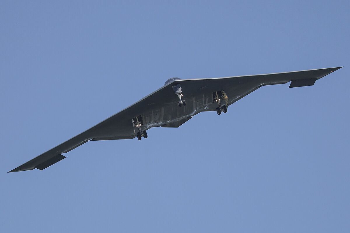 A B-2 bomber flies against a blue sky after returning from a massive strike on Iranian nuclear sites just hours before.