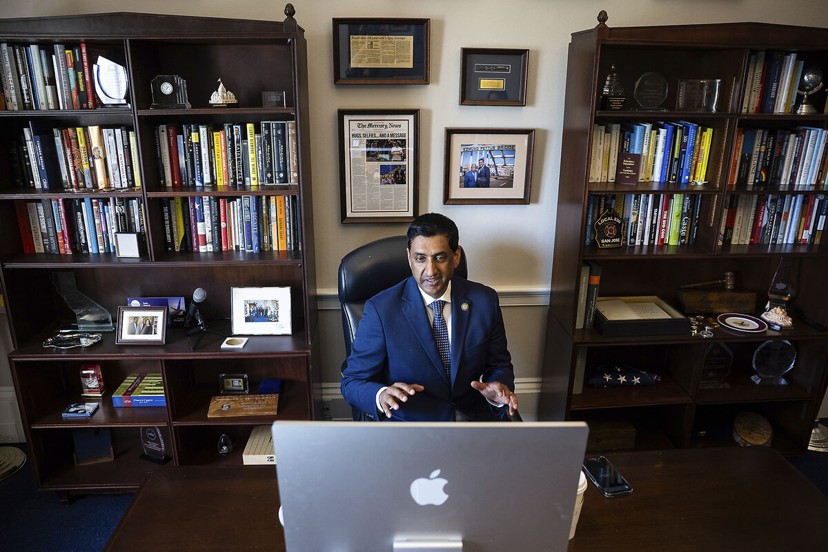 Democratic Rep. Ro Khanna, in a blue suit, sits at a desk, facing a computer screen, as he takes part in a podcast interview.