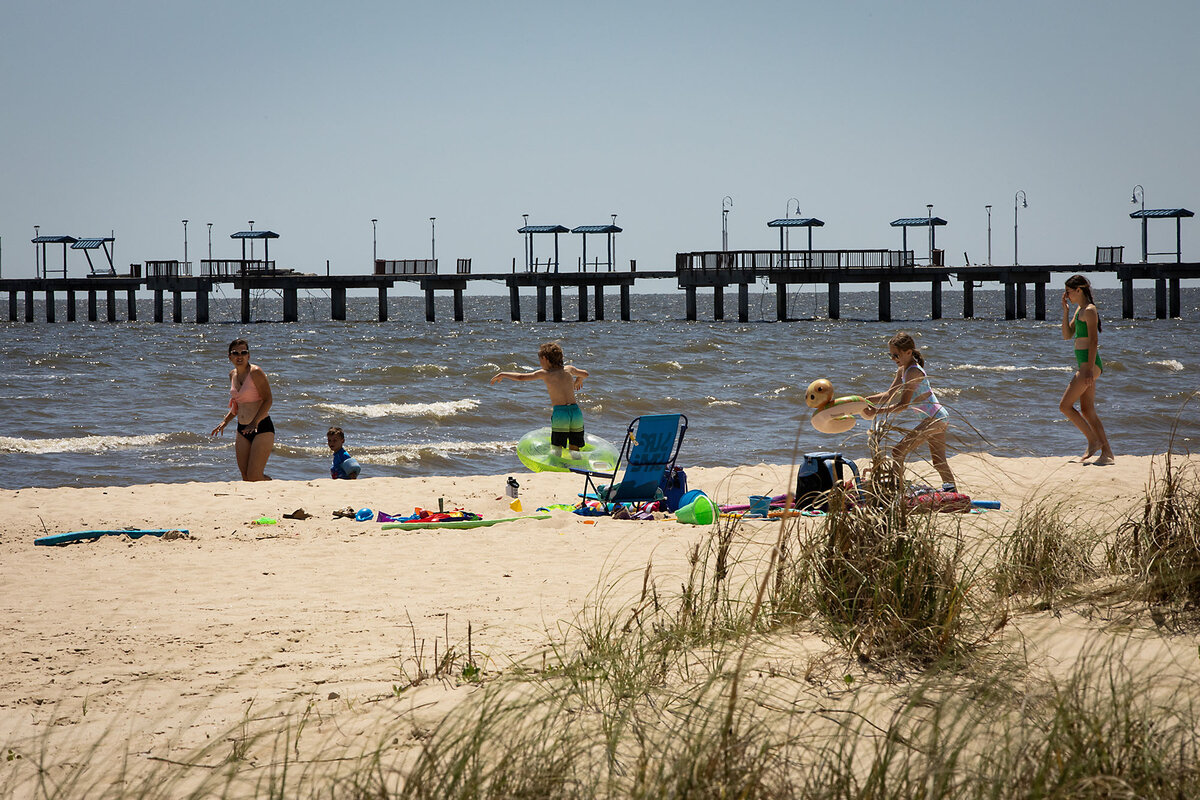  A family enjoys the beach, in Waveland, Mississippi, on April 16, 2025. With the U.S. fertility rate at an all-time low, the Trump administration wants Americans to have more babies. 
