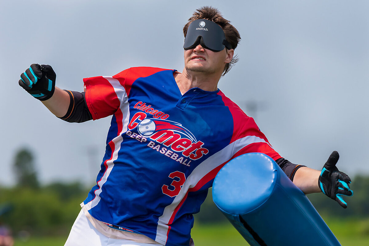 Chicago Comet Dustin Youngren hits a 4-foot-high padded base during a 2019 game in Indianapolis.