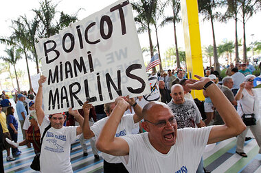 Miami Marlins' Ozzie Guillen flying home for news conference Tuesday to try  to stem damage over Castro remarks