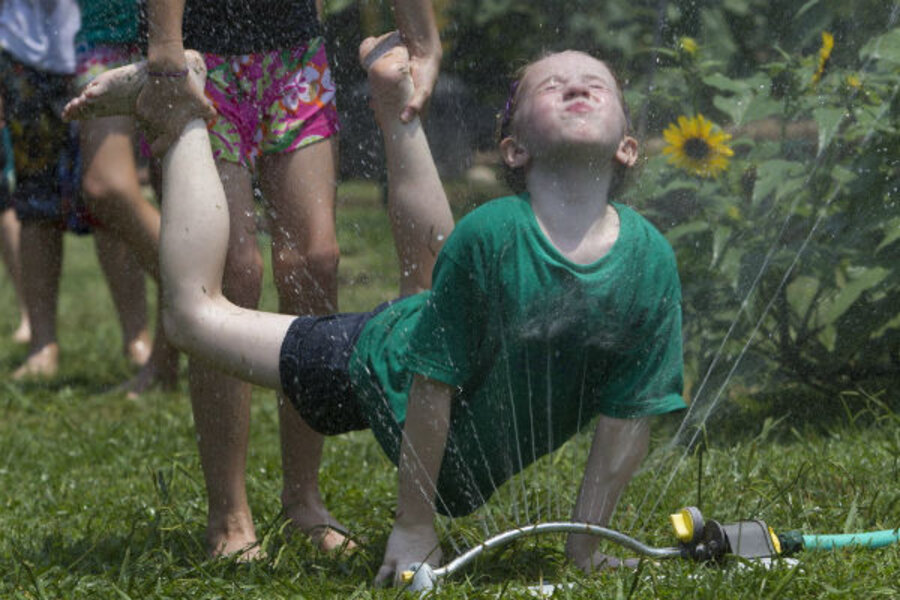 kids playing in sprinkler