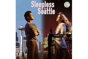 nora who directed sleepless in seattle crossword clue