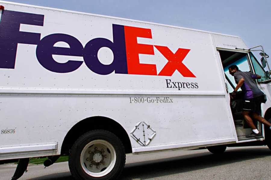 FedEx earnings cut; weak global economy to blame 