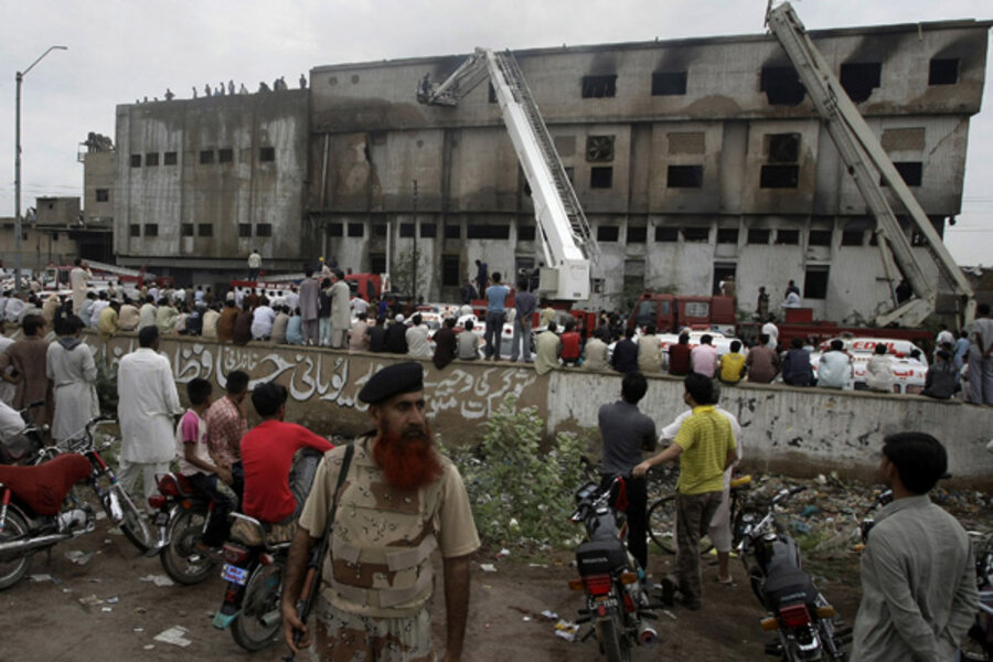 Rescue workers save people from a building fire in Pakistan