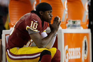 LANDOVER, Md. (AP) — After watching Robert Griffin III get knocked