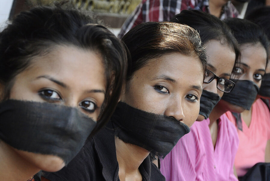 18. Members of the All Assam Photojournalist Association wear black sashes ...