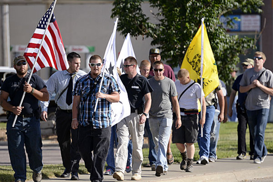 Starbucks allows guns, reluctantly