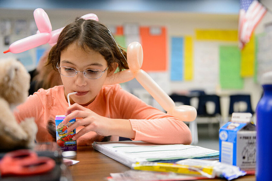 child eating breakfast at school