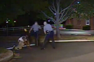 photo police officer curb stomping black man