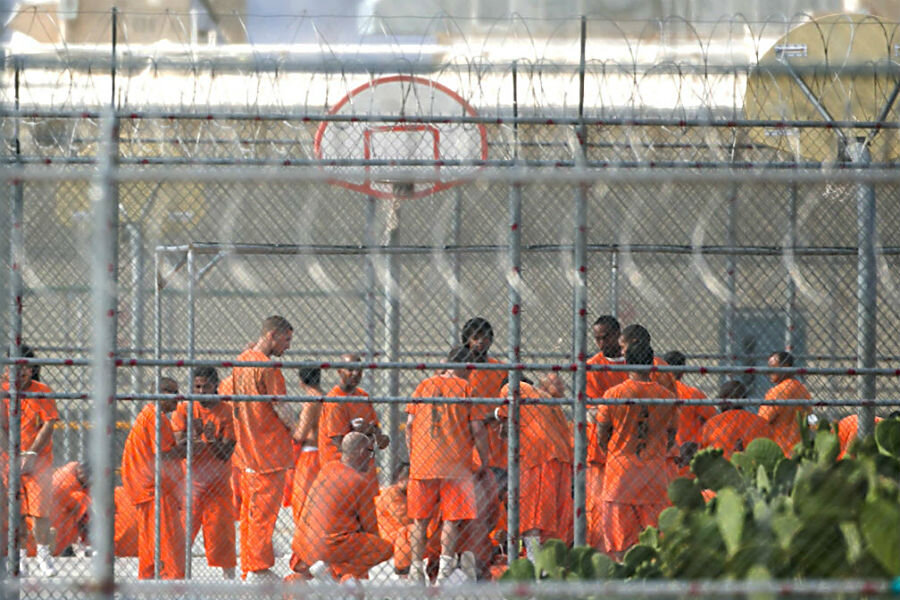 Prison inmates stand in the yard at Arizona State Prison-Kingman in Golden ...