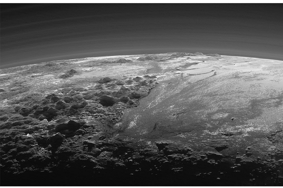 New Horizons images show Pluto has blue skies and red water ice