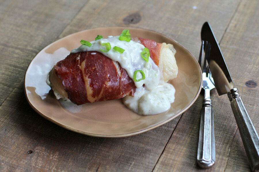 Country ham wrapped stuffed chicken with green onion gravy