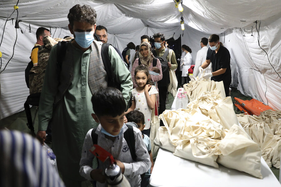 After deadly blast, urgent evacuations from Kabul resume