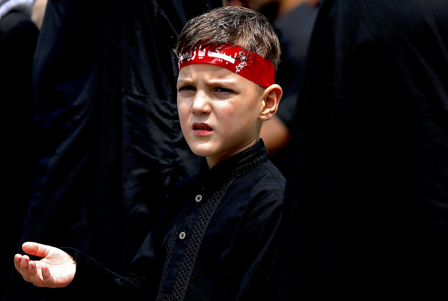 A young Muslim boy displays his stick-fighting skills during a procession  to mark Ashoura in New Delhi, India, Saturday, July, 29, 2023. Ashoura is  the tenth day of Muharram, the first month