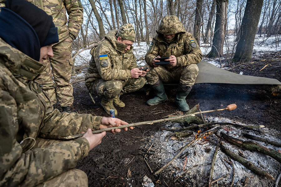 A shell-shocked Ukrainian soldier in a trench is getting taken