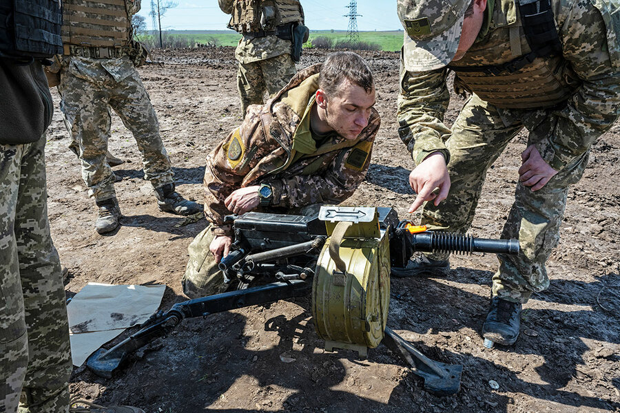 Ukrainian soldiers burn Russian flag as they reclaim territory