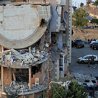 Lebanese army soldiers deploy around a destroyed building hit by an Israeli airstrike, in Barja village, Lebanon, Oct. 12, 2024. 