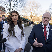 Border czar Tom Homan and Homeland Security Secretary Kristi Noem speak with journalists outside the White House. 