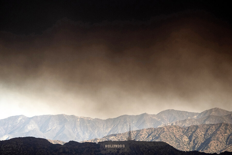 Heavy smoke from wildfires passes over the Hollywood sign in Los Angeles, Jan. 8, 2025. 