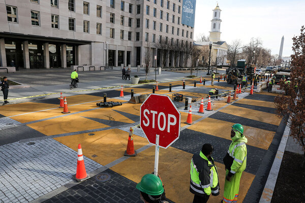 Black Lives Matter Plaza has orange traffic cones down the middle as work begins to transform it